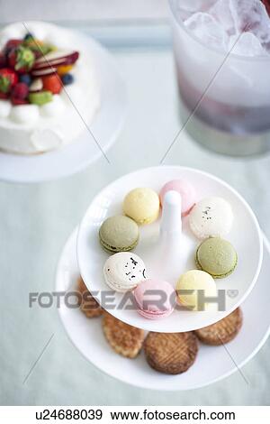 Cakestand with cookies, cake and an ice bucket with champagne View Large Photo Image Stock Photo - Cakestand with cookies, cake and an ice bucket with champagne. Fotosearch