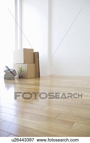 Cardboard boxes in an empty room View Large Photo Image Stock Photo - Cardboard boxes in an empty room. Fotosearch