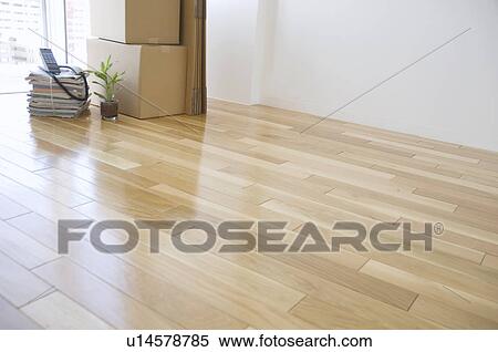 Stock Photography - Cardboard boxes in an empty room. Fotosearch