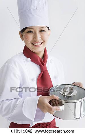 Chef holding pan View Large Photo Image Stock Image - Chef holding pan. Fotosearch