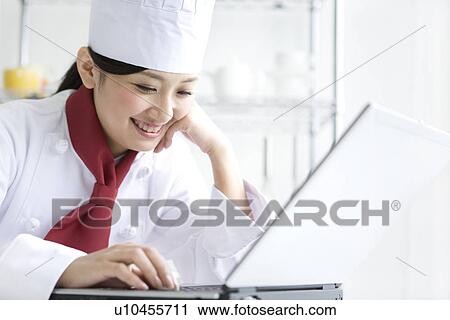 Chef using laptop View Large Photo Image Stock Image - Chef using laptop. Fotosearch