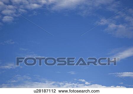 Stock Image - Clouds in blue sky. Fotosearch