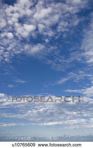 Stock Photo - Clouds in blue sky. Fotosearch