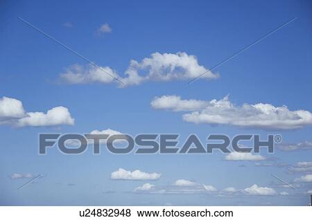 Stock Photo - Clouds in blue sky. Fotosearch