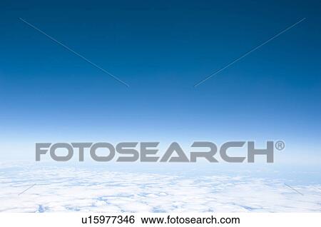 Stock Photograph - Clouds in blue sky. Fotosearch