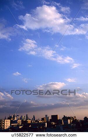 Stock Photo - Cloudscape and buildings. Fotosearch
