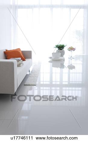 Coffee and a glass of candy on a living room table View Large Photo Image Stock Image - Coffee and a glass of candy on a living room table. Fotosearch