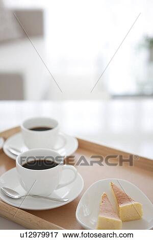 Coffee and cake on a serving tray View Large Photo Image Stock Photo - Coffee and cake on a serving tray. Fotosearch