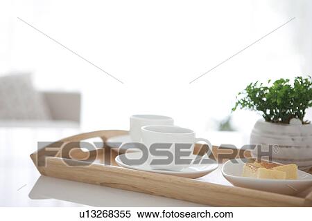 Coffee and cake on a serving tray View Large Photo Image Stock Photography - Coffee and cake on a serving tray. Fotosearch