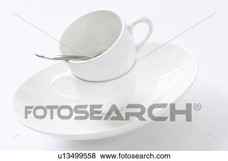 Stock Photo - Coffee cups stacked on table. Fotosearch