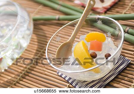 Stock Photography - Cold fruit snacks on a tatami mat. Fotosearch