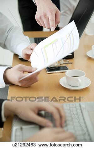 Colleagues working in office View Large Photo Image Stock Image - Colleagues working in office. Fotosearch