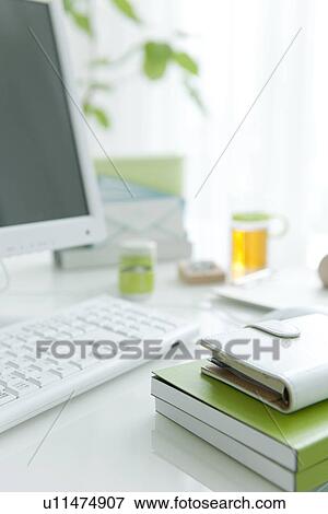 Stock Photo - Computer desk with address book. Fotosearch