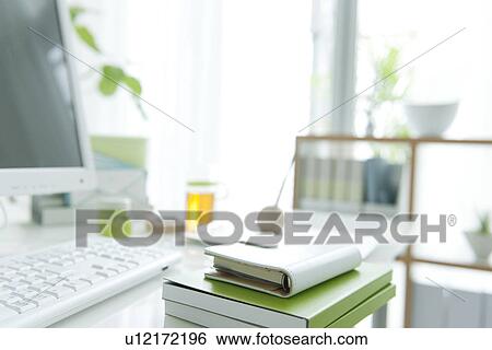 Stock Photograph - Computer desk with address book. Fotosearch