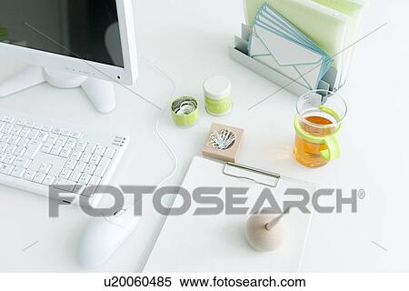 Computer desk with office stationery View Large Photo Image Stock Photography - Computer desk with office stationery. Fotosearch