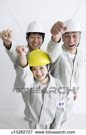 Construction workers cheering View Large Photo Image Stock Photo - Construction workers cheering. Fotosearch
