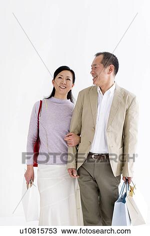 Couple doing some shopping View Large Photo Image Stock Image - Couple doing some shopping. Fotosearch