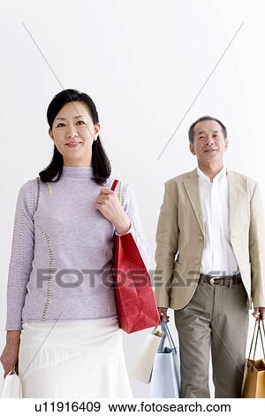 Stock Photo - Couple doing some shopping. Fotosearch