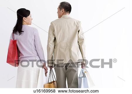 Couple doing some shopping View Large Photo Image Stock Photo - Couple doing some shopping. Fotosearch