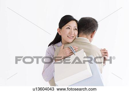Stock Image - Couple embracing each other. Fotosearch