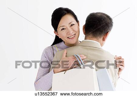 Stock Photo - Couple embracing each other. Fotosearch