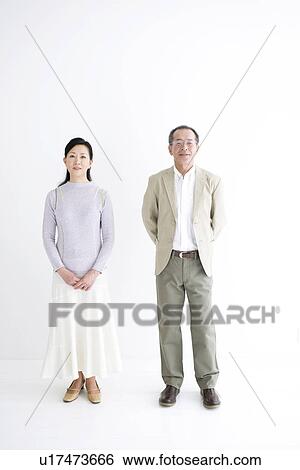 Stock Photograph - Couple standing side by side. Fotosearch