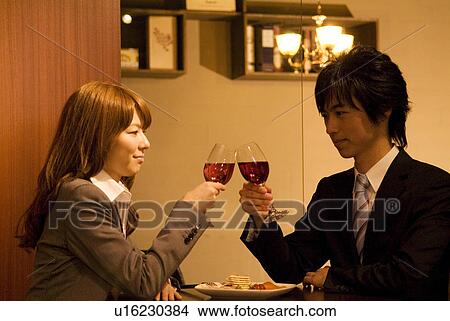 Couple toasting wineglasses View Large Photo Image Picture - Couple toasting wineglasses. Fotosearch