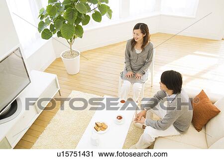Stock Image - Couple watching television together. Fotosearch