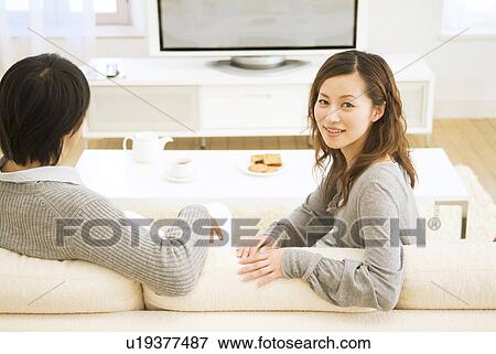 Stock Photo - Couple watching television together. Fotosearch