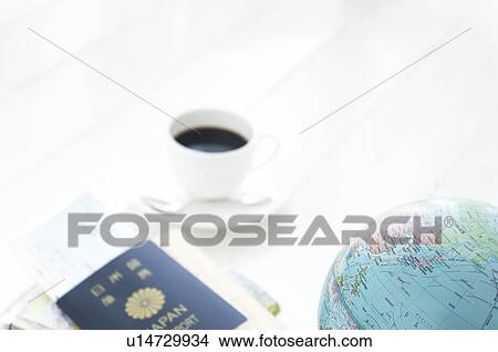 Picture - Cup of coffee and a globe. Fotosearch