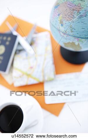 Stock Image - Cup of coffee and a globe. Fotosearch