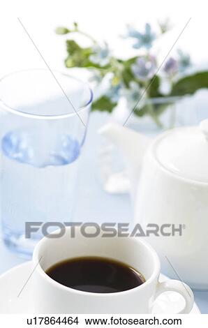 Picture - Cup of coffee on table setting. Fotosearch