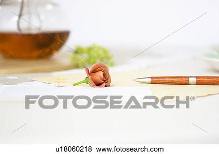 Stock Photo - Cup of tea on table setting. Fotosearch