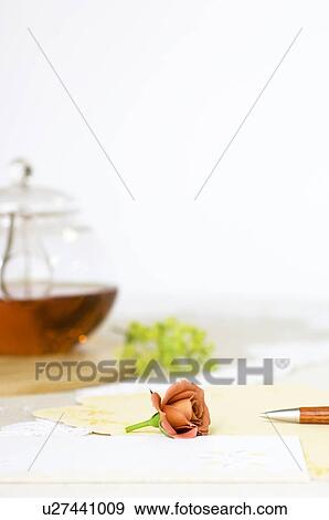 Cup of tea on table setting View Large Photo Image Stock Photo - Cup of tea on table setting. Fotosearch