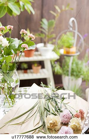 Stock Photo - Cut flowers and a vase. Fotosearch