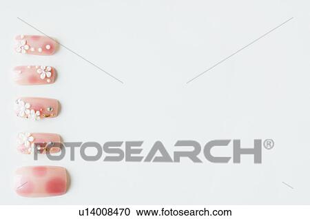 Stock Image - Decorated false nails. Fotosearch