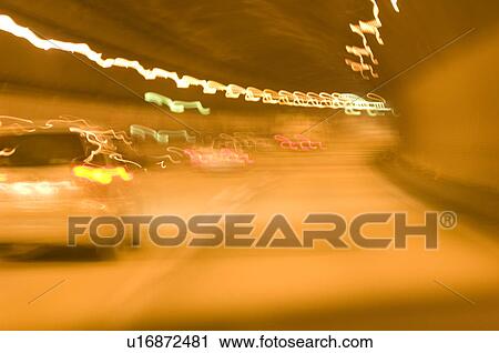 Defocused cars going through a tunnel View Large Photo Image Stock Image - Defocused cars going through a tunnel. Fotosearch