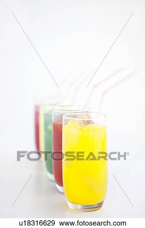 Stock Photo - Different flavours of juice in a row. Fotosearch