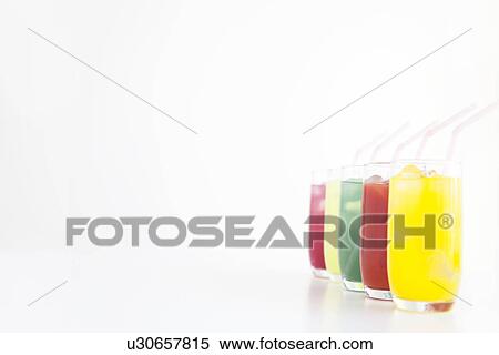 Stock Photography - Different flavours of juice in a row. Fotosearch