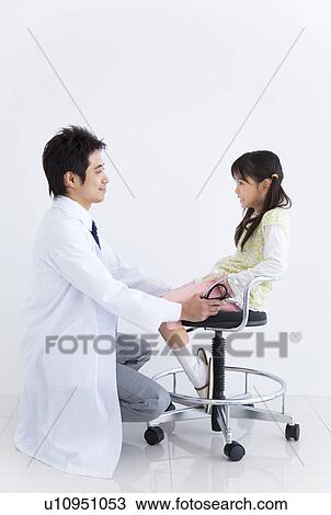 Doctor examining a child View Large Photo Image Stock Image - Doctor examining a child. Fotosearch
