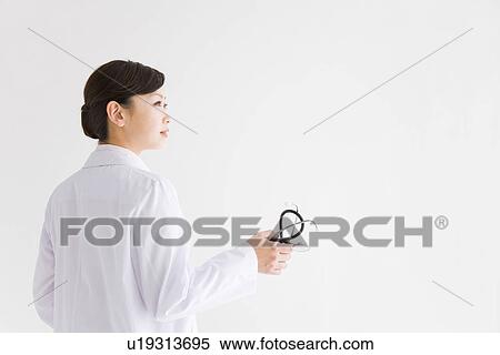Stock Photography - Doctor holding stethoscope. Fotosearch