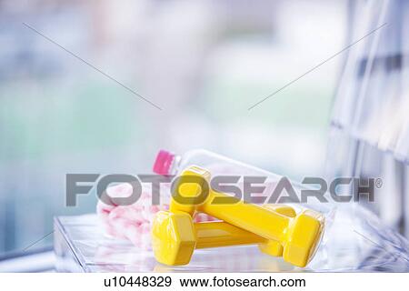 Stock Photo - Dumbbells and a water bottle. Fotosearch