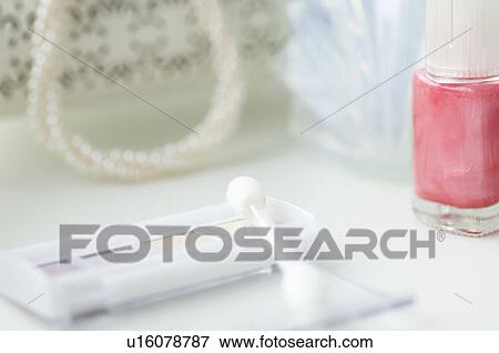 Stock Photo - Eyeshadow and nail polish. Fotosearch