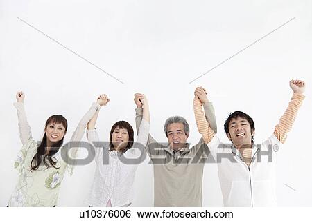 Stock Photograph - Family of four holding hands. Fotosearch