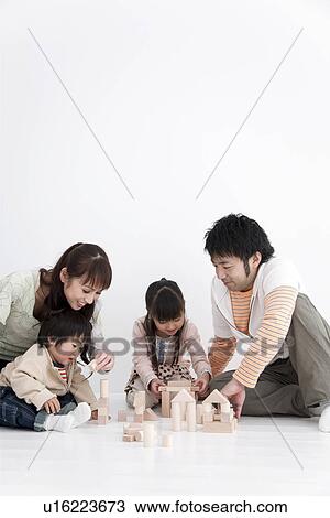 Family playing with toy blocks View Large Photo Image Stock Image - Family playing with toy blocks. Fotosearch