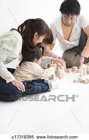 Family playing with toy blocks View Large Photo Image Stock Photography - Family playing with toy blocks. Fotosearch