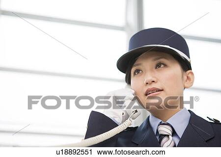 Female guard on the telephone View Large Photo Image Stock Image - Female guard on the telephone. Fotosearch
