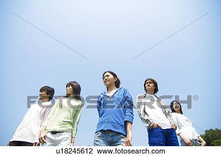 Stock Image - Five young people standing. Fotosearch