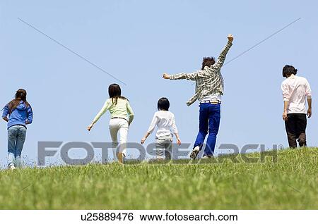 Five young people walking on grass hill View Large Photo Image Stock Photograph - Five young people walking on grass hill. Fotosearch