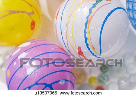 Floating balls and balloons in a paddling pool View Large Photo Image Stock Photography - Floating balls and balloons in a paddling pool. Fotosearch